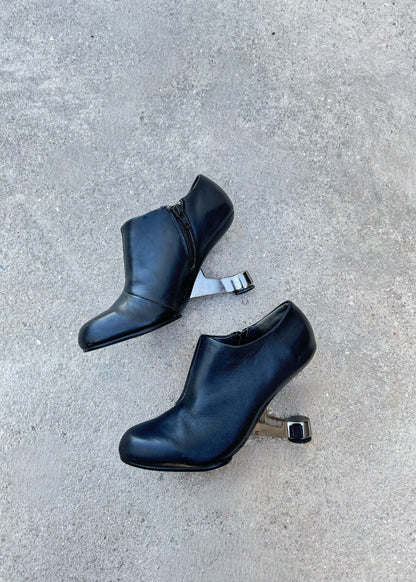 Bottines à talon sculptural United Nude en cuir noir